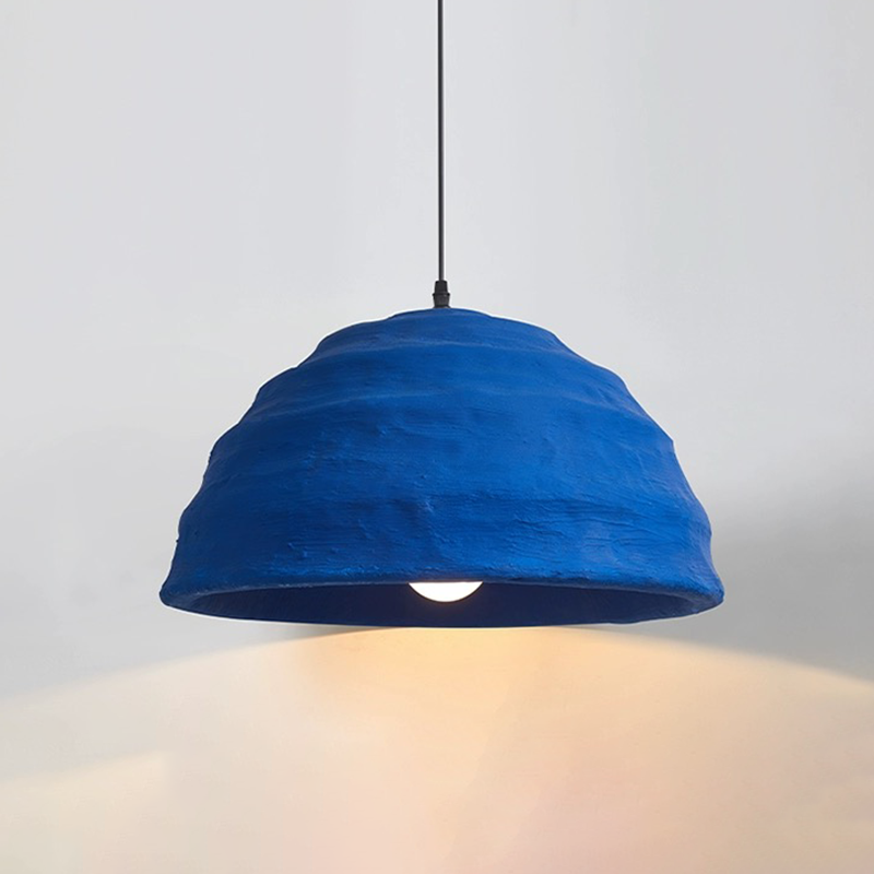 Klein Blue Dome Pendant Light illuminating a modern living room