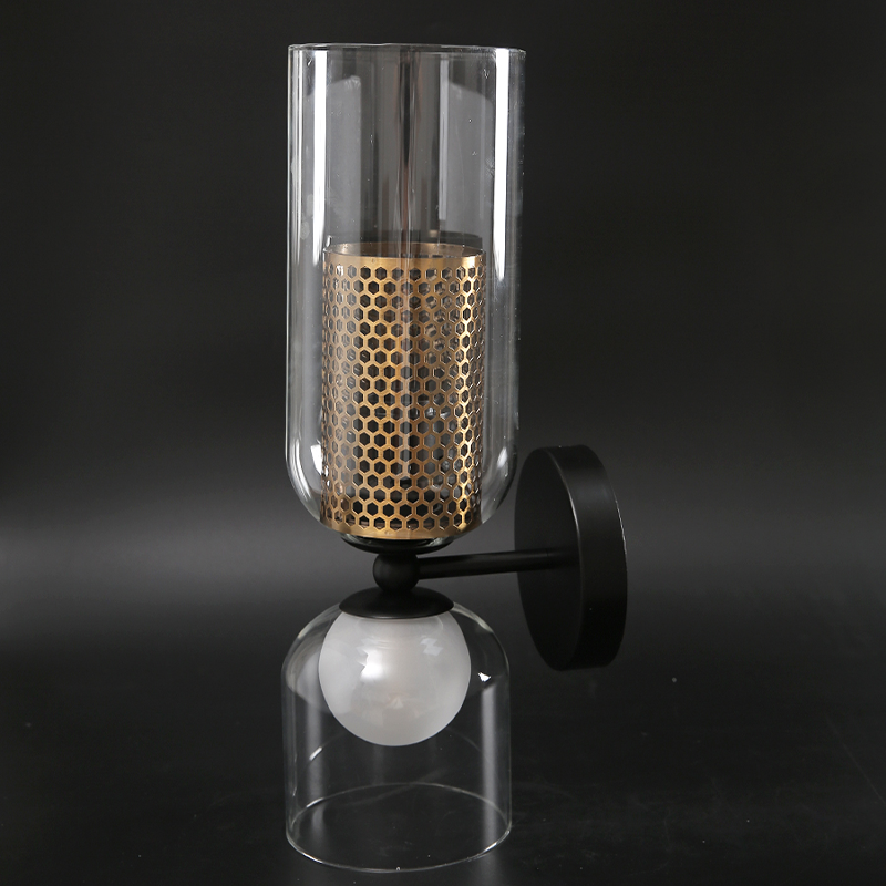 NordLight LED wall lamp mounted on white dining room wall with brass honeycomb detail.