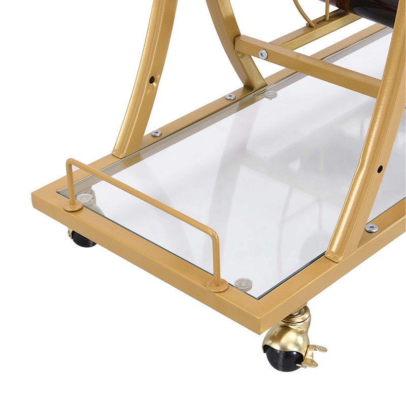Close-up of the gold bar carts glass holder and shelves, emphasizing its luxurious design.