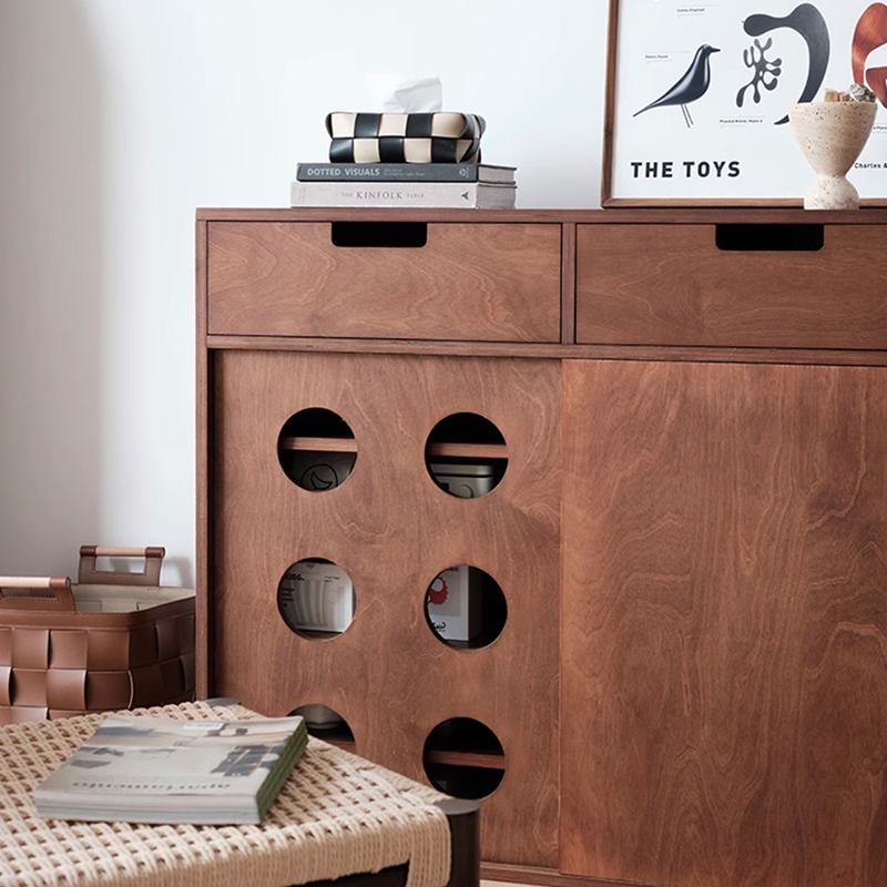 Close-up of the cabinets birchwood finish and hardware details, emphasizing quality craftsmanship.