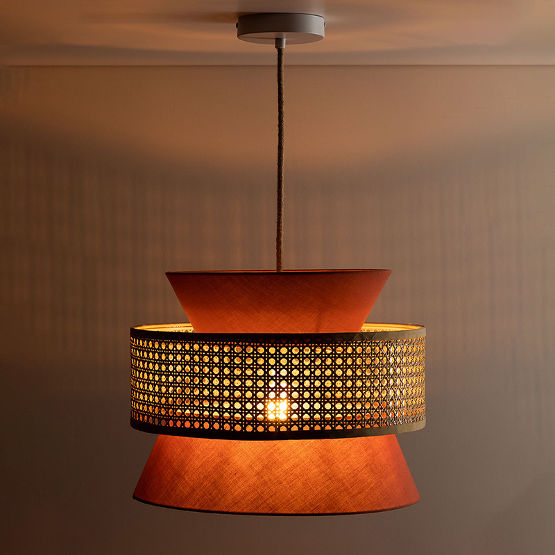 Side view of colorful rattan pendant with warm ambient lighting effect
