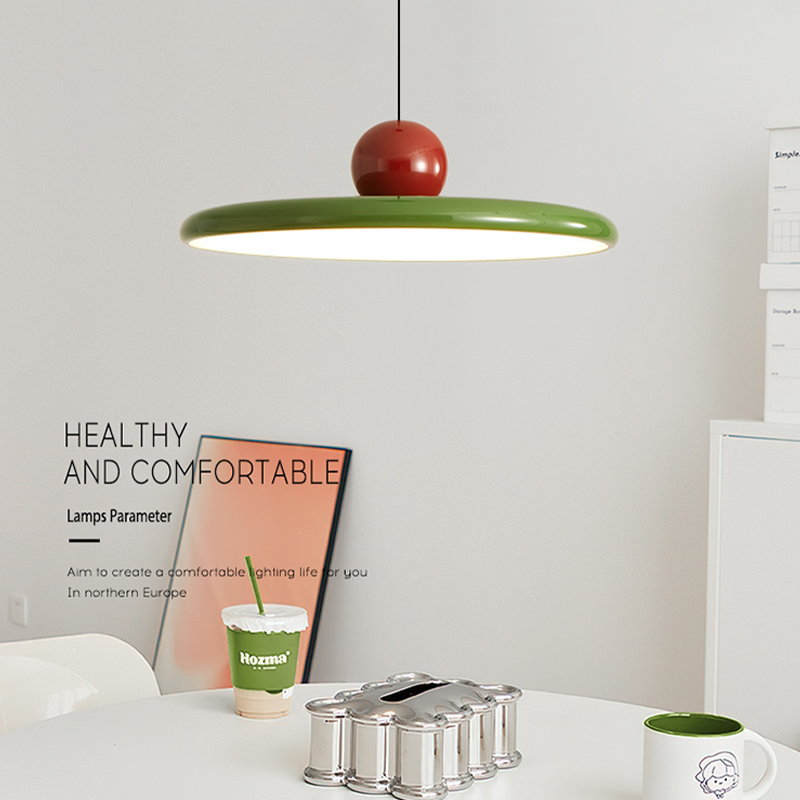 Close-up of Retro Flying Saucer Pendant Light showcasing the green finish.