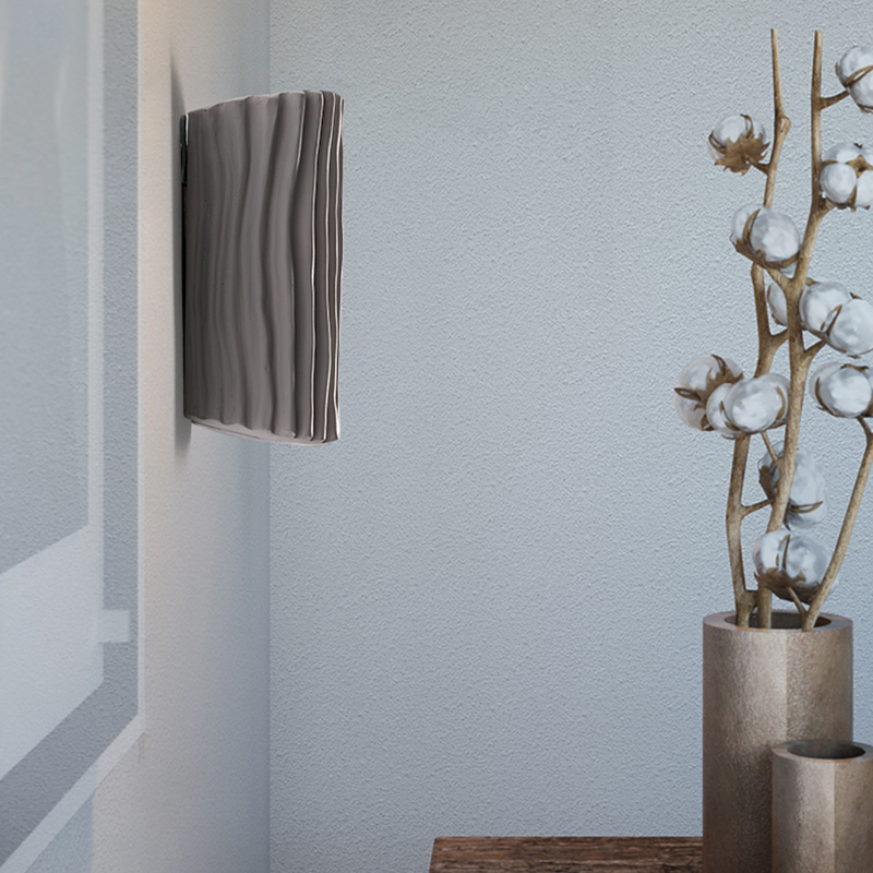 Close-up of the modern geometric LED wall sconce showcasing its pleated design