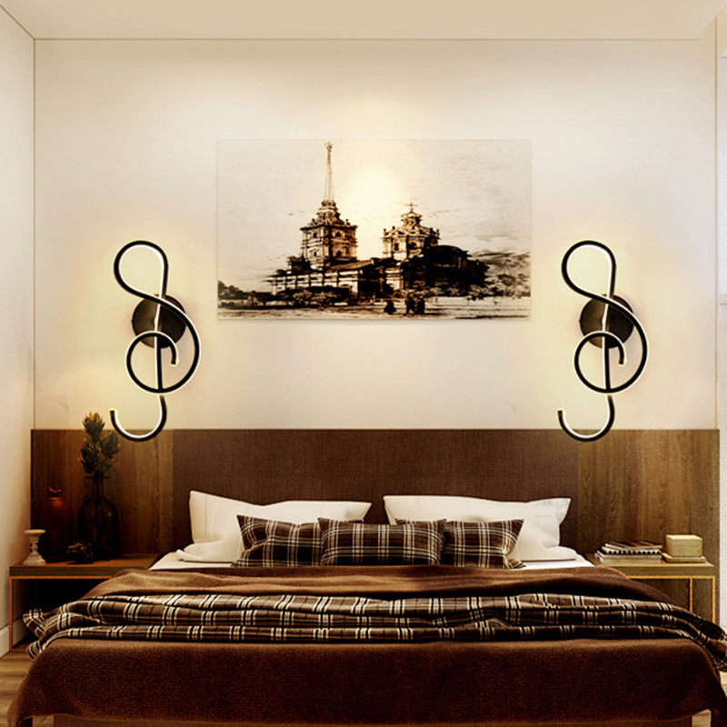 Close-up of black and white wall lamp showcasing acrylic shade and metal texture