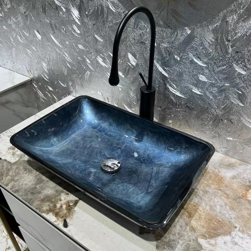 Stylish gray blue shoe-shaped tempered glass vessel sink for modern bathrooms.