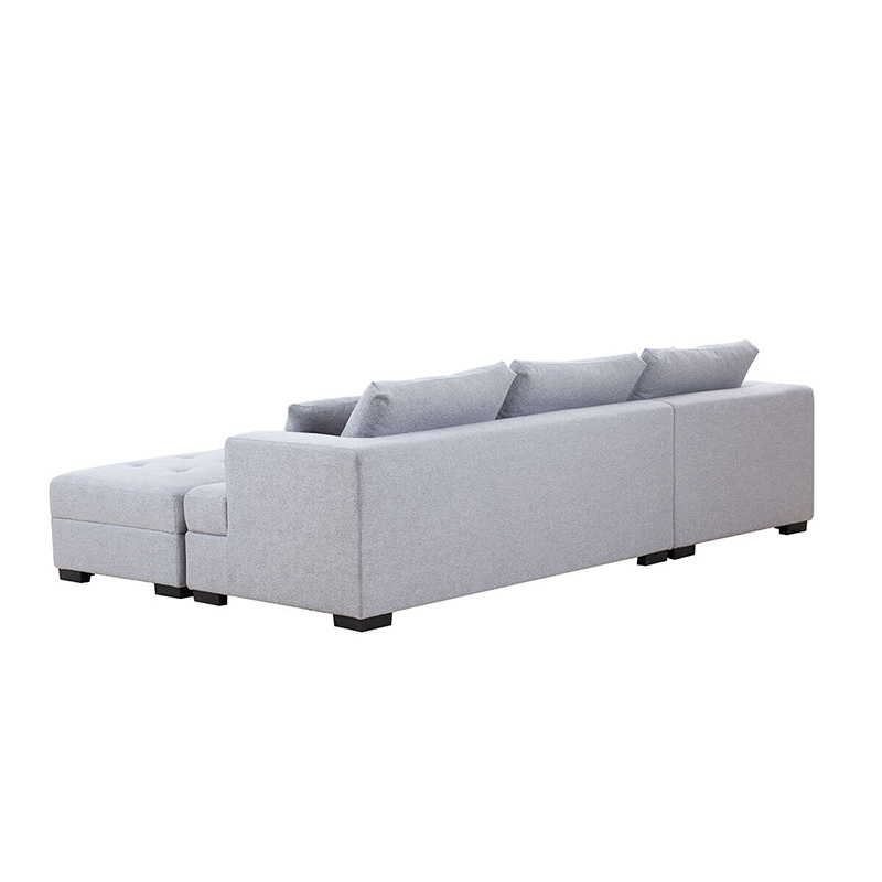 Stylish light grey sectional with ottoman, perfect for lounging
