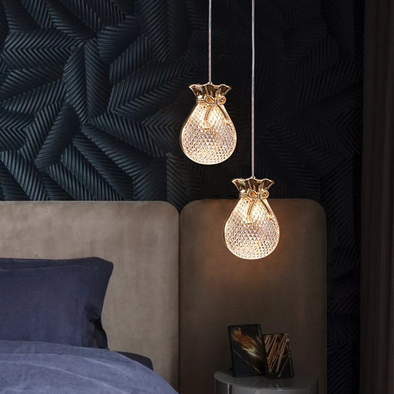 Elegant gold glass pendant light hanging in a modern dining room decor.