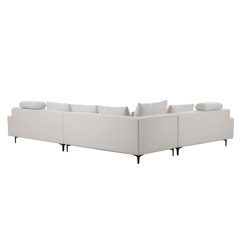 Close-up of the comfortable cushions on the off white L-shaped sofa, showcasing its soft fabric.