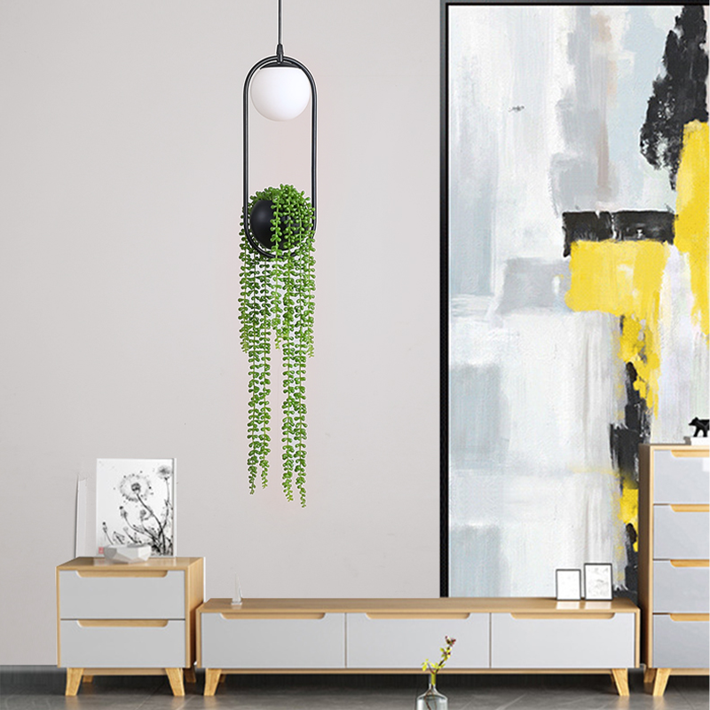Chic modern LED plant pendant light showcasing indoor plants in a stylish setting.