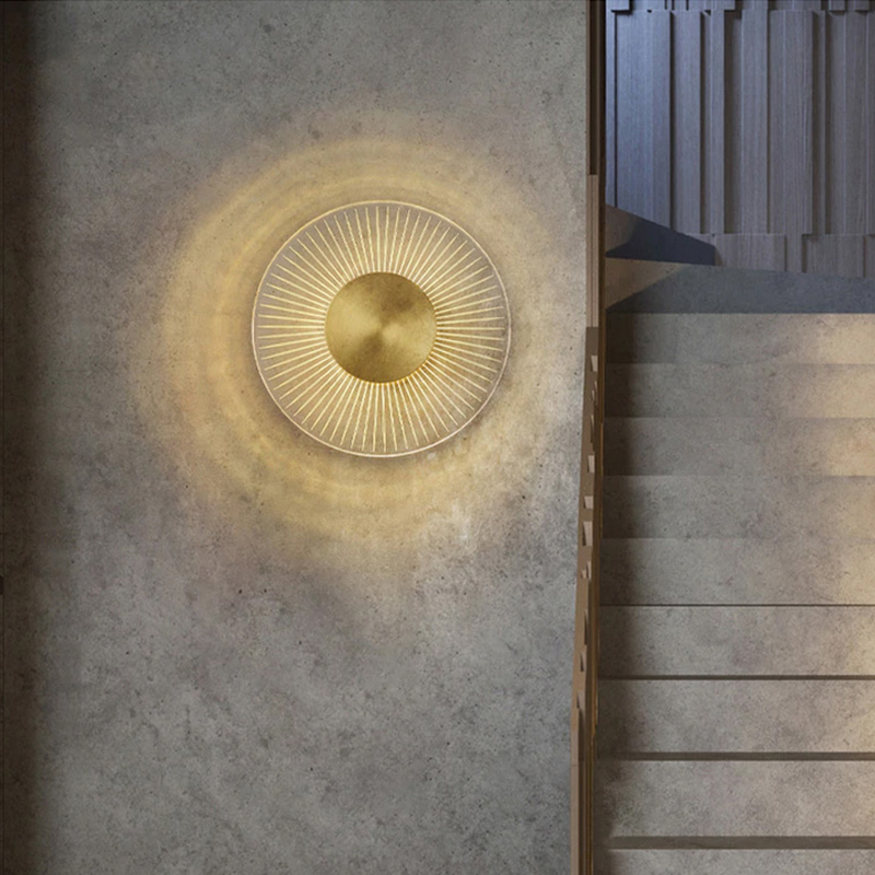 Modern wall sconce installed in a cozy bedroom, providing warm illumination.