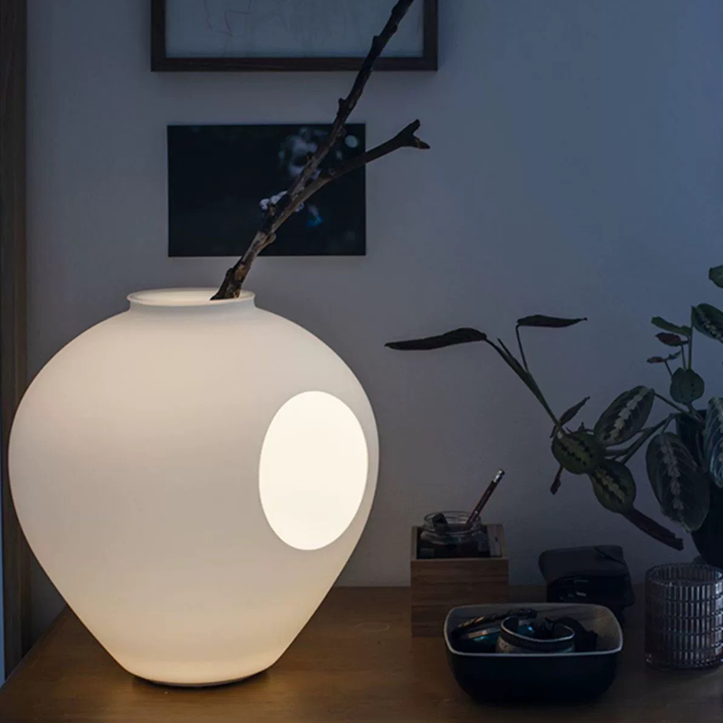 Side view of LumaBloom wireless vase lamp showing floral arrangement and LED glow