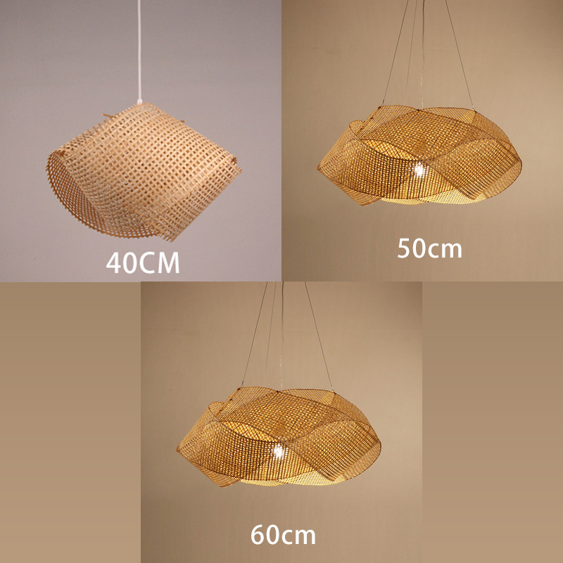 Close-up view of the vintage bamboo light hanging above a dining table, highlighting its natural texture.