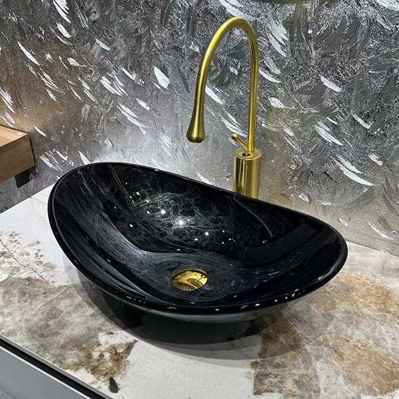 Elegant gray black round tempered glass wash basin with droplet faucet.