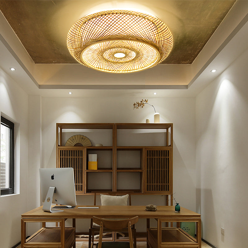 Elegant bamboo flush mount light illuminating a cozy dining room.