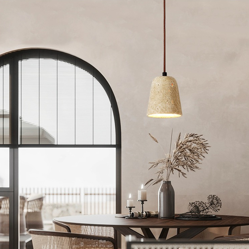 Luxe warm light pendant showcasing the yellow cavity-stone from a side angle, ideal for dining rooms.