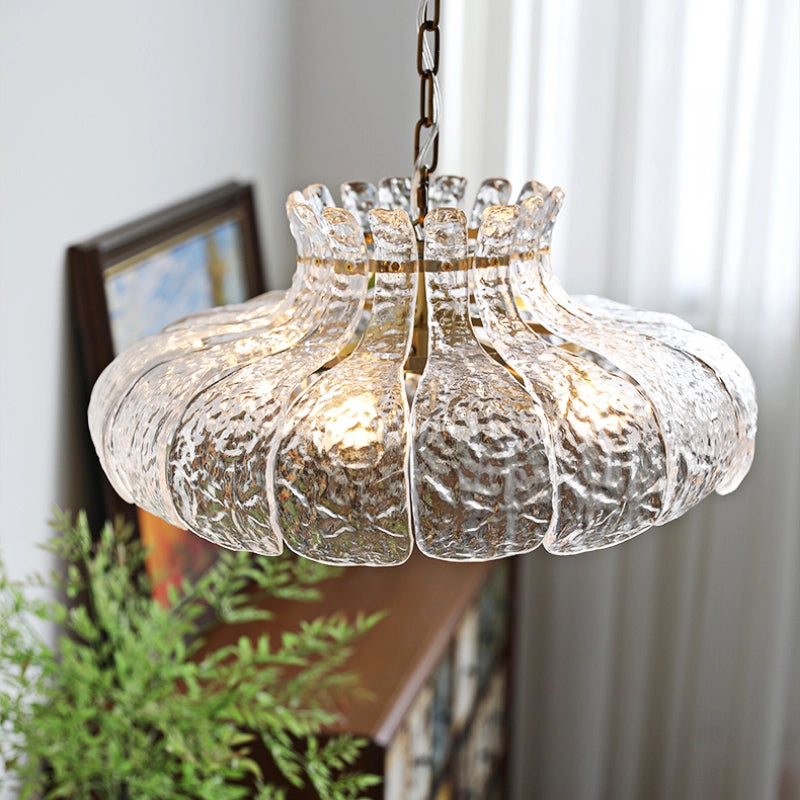 Chic French flower petal glass pendant light hanging in a modern kitchen