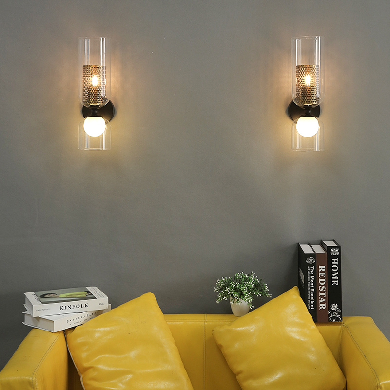 Side view of modern lighting wall sconce casting warm glow on hallway wall decor.
