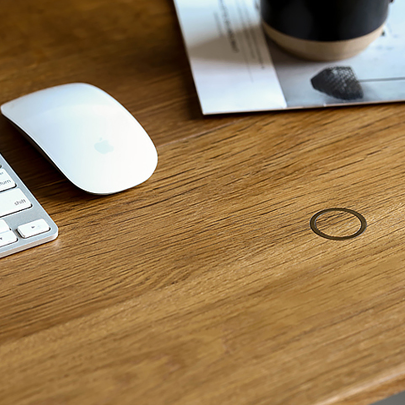Home office setup featuring the Nordic desk with pull-out glass writing surface.