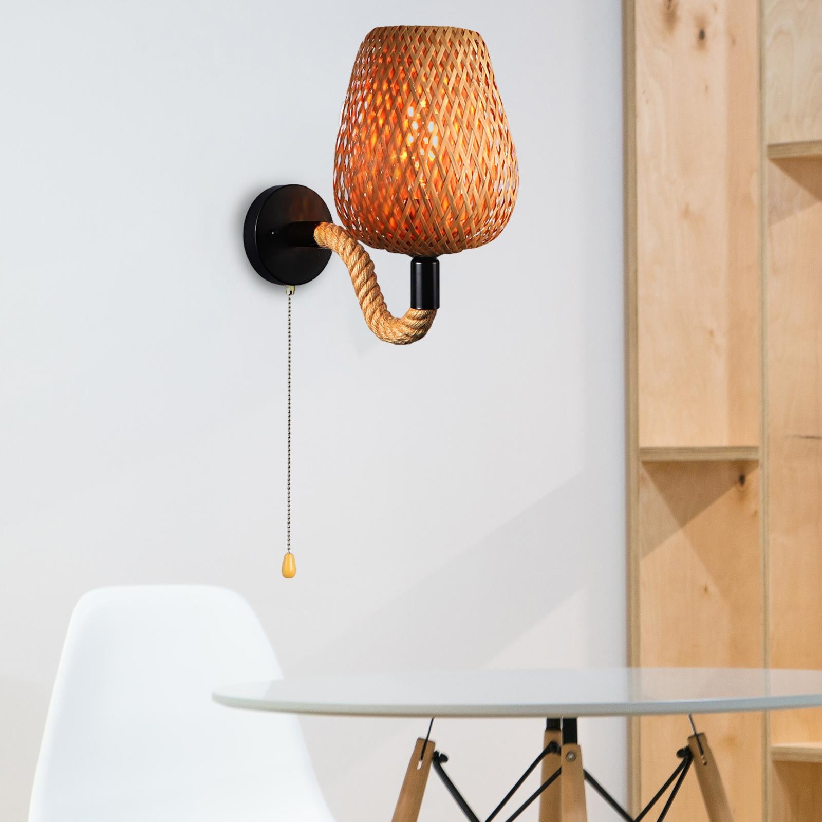 Angled view of bamboo rattan wall light mounted beside a reclaimed wood shelf