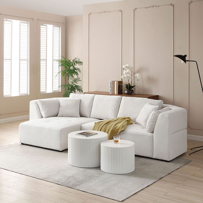 Elegant beige sectional sofa from a side view, showcasing the left chaise.