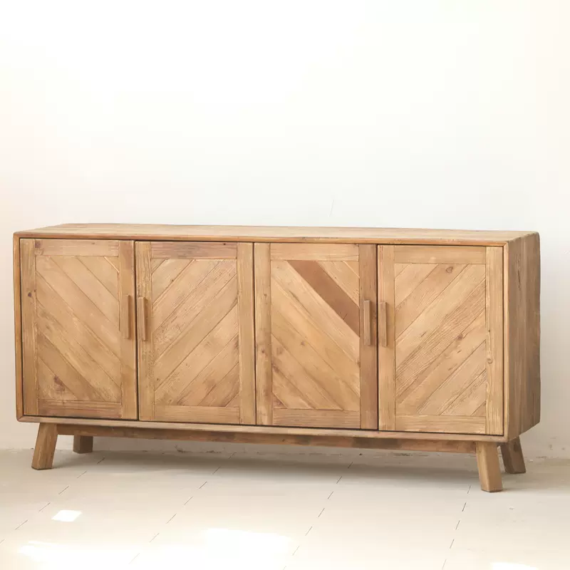 Interior view of the sideboard cabinet displaying ample storage space and woven cane front design.