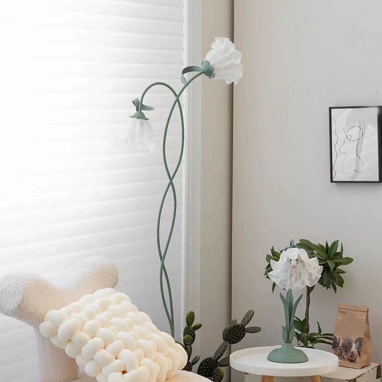 Close-up view of the green floor lamp with white glass shades