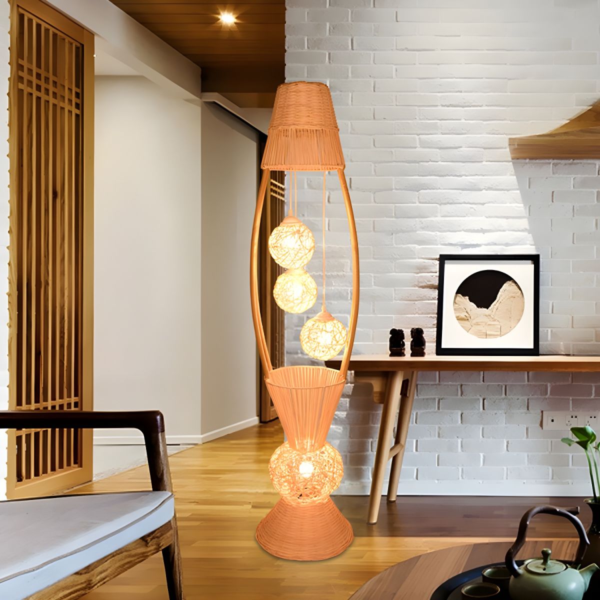Elegant bamboo fish basket floor lamp in living room setting, providing warm light.