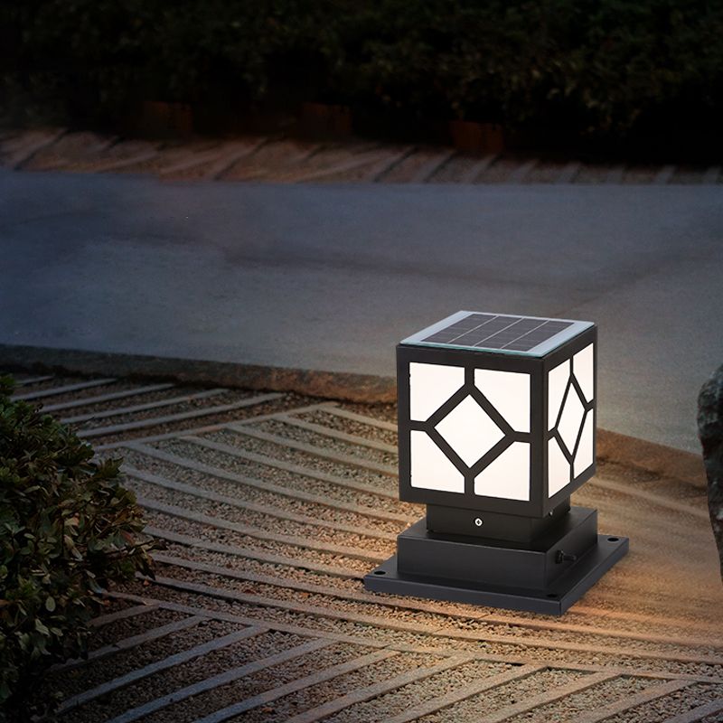 Sleek black metal outdoor post light showcasing LED bulbs in a garden setting.