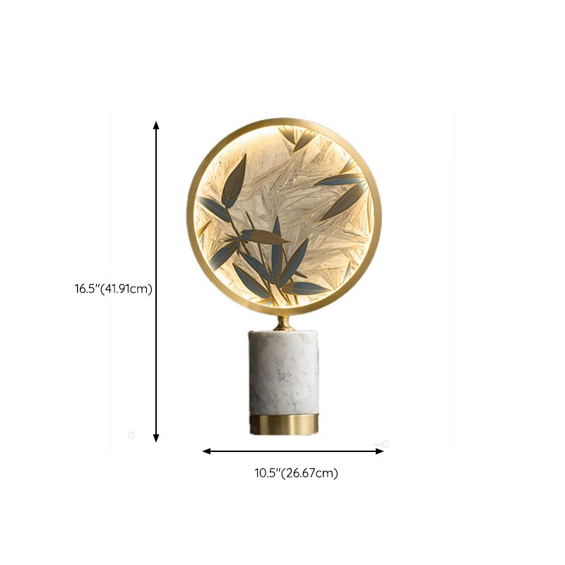 Close-up view of the modern lamps intricate bamboo leaf design and light shade.