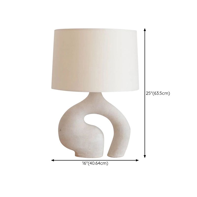 Close-up of the elegant white resin lamp, highlighting its chic details.
