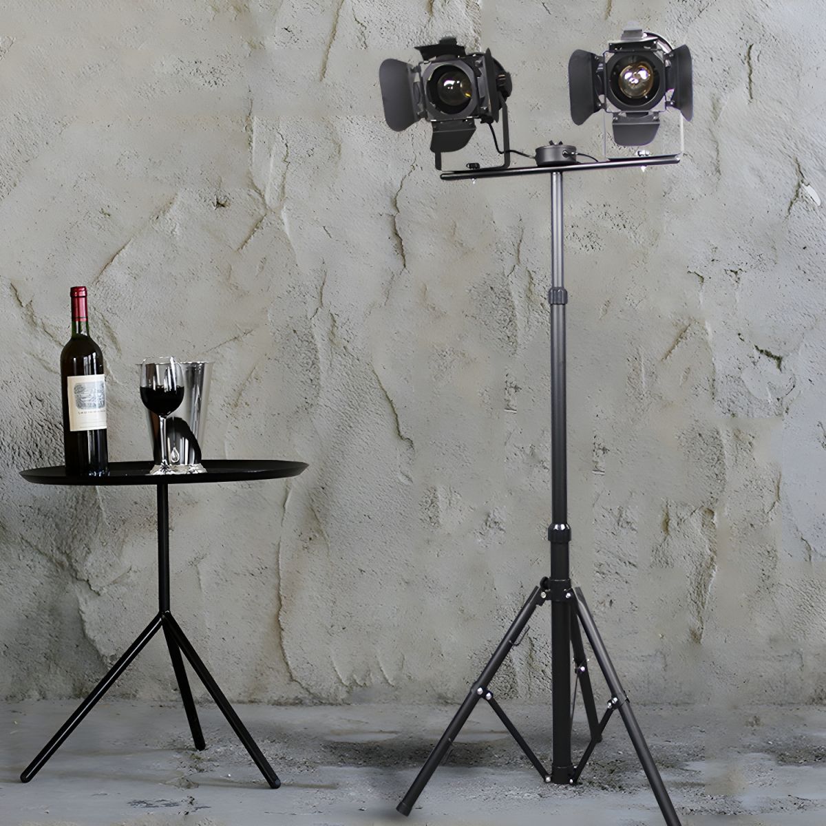 Steampunk industrial tripod floor lamp showcasing its black metal shade from a side angle.