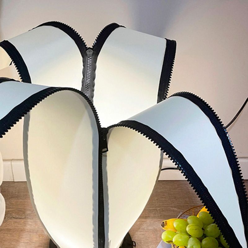 Close-up of the paper shade and unique design features of the lamp.