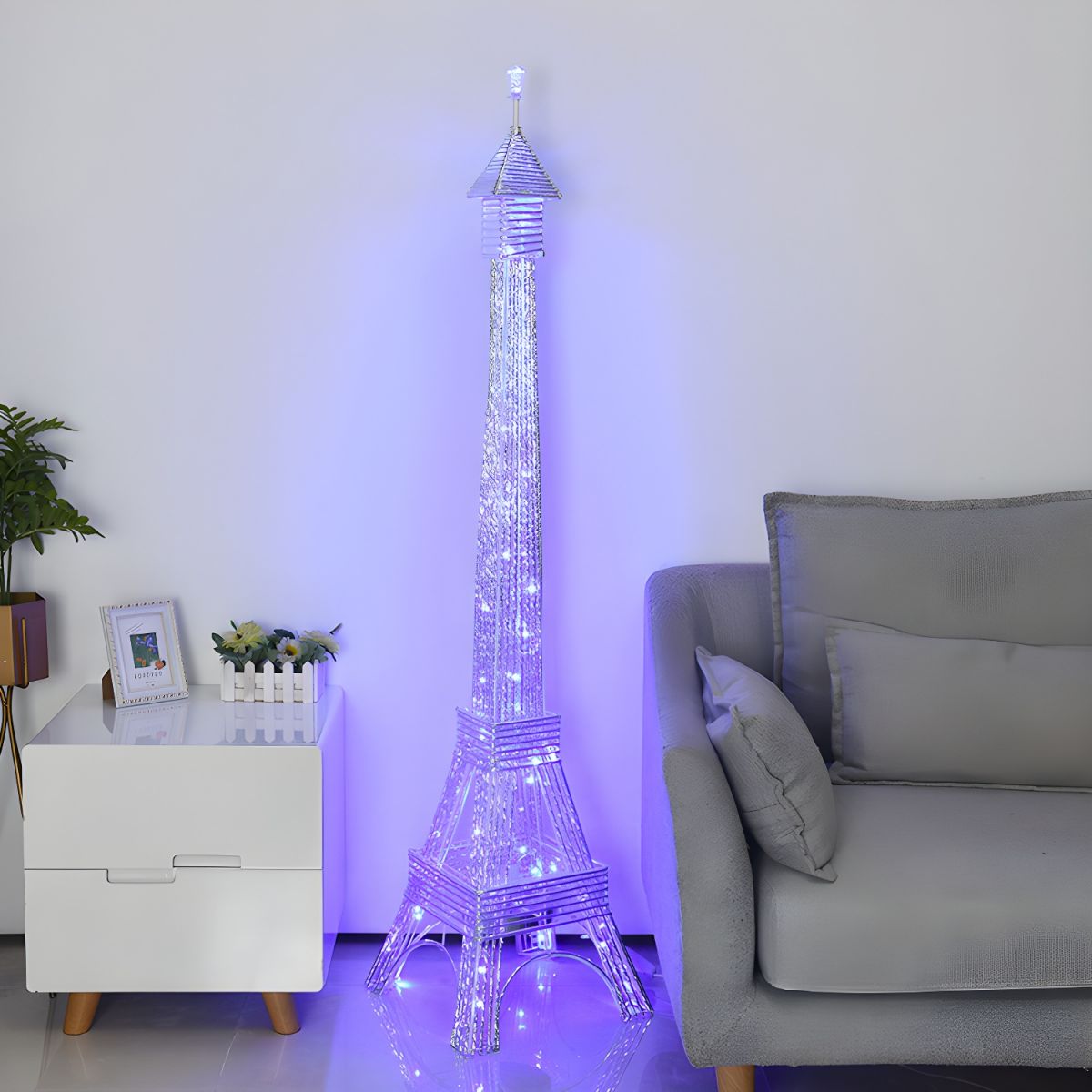 Elegant Eiffel Tower floor lamp in a stylish living room setting, showcasing its two-head design and soft illumination.