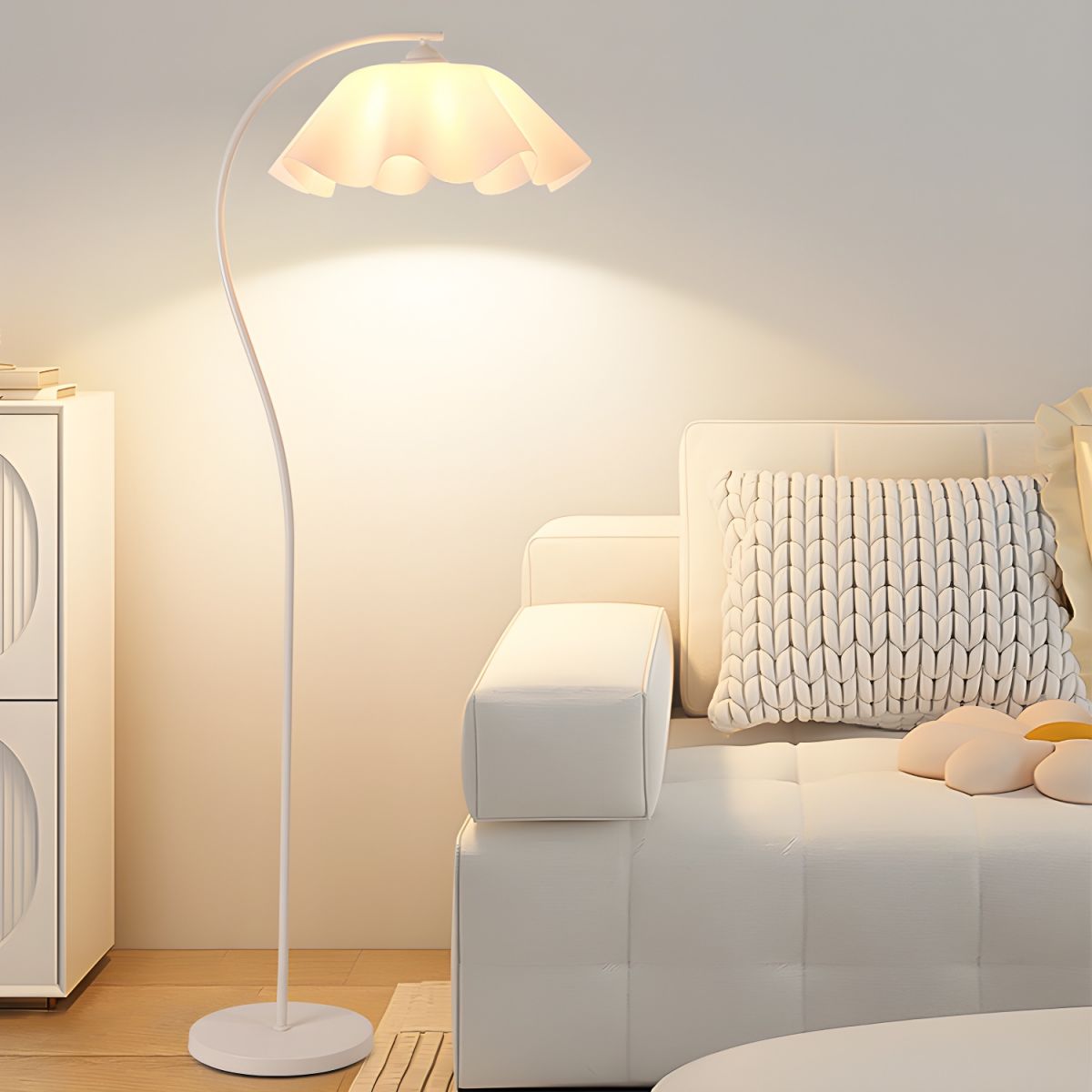 Elegant white metal floor lamp with dome shade in a cozy living room setting.