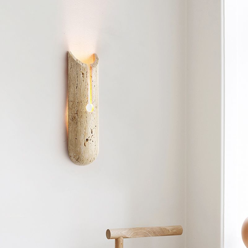 Close-up of the beige wall sconce showcasing its stone shade and modern design