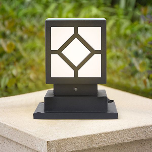 Sleek black metal outdoor post light showcasing LED bulbs in a garden setting.
