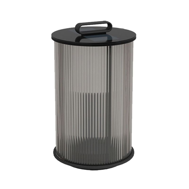 LumiAura metal outdoor lantern placed on garden wall at dusk