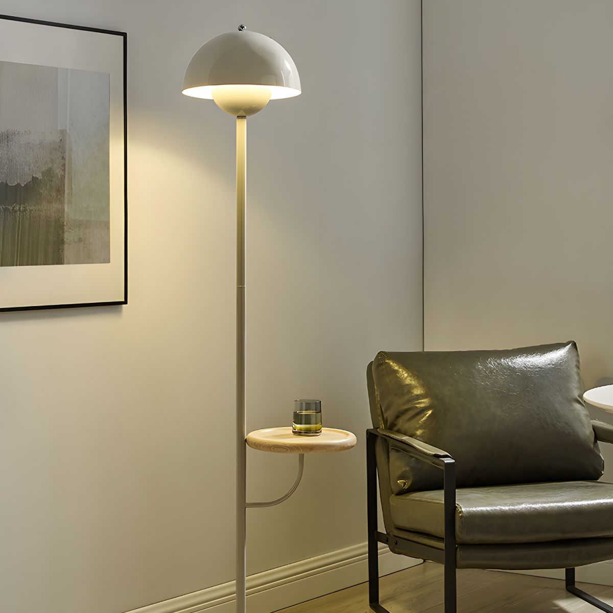 Side view of the sleek white iron dome floor lamp showcasing its shelf and dome shade.