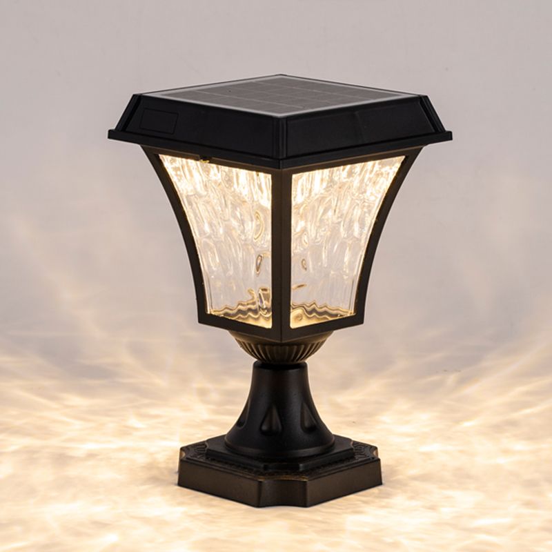 Garden setting featuring the waterproof solar LED post light amidst colorful flowers.