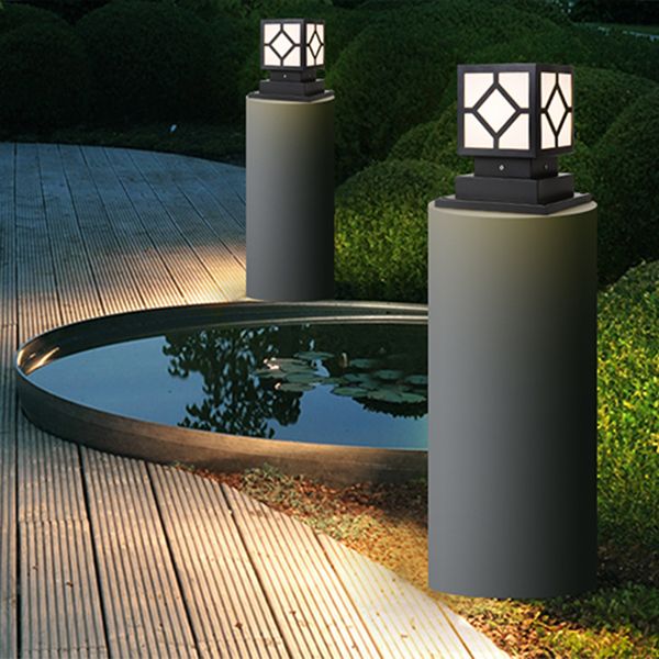 Sleek black metal outdoor post light showcasing LED bulbs in a garden setting.