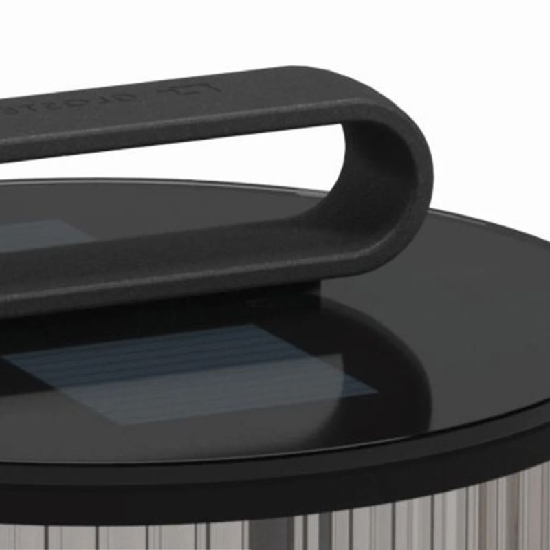 Front view of solar post light showing ribbed glass and warm glow