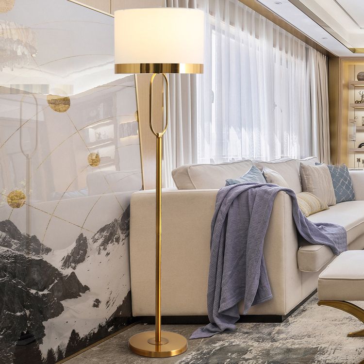 Elegant white column lamp in a cozy bedroom setting, adding warm light.