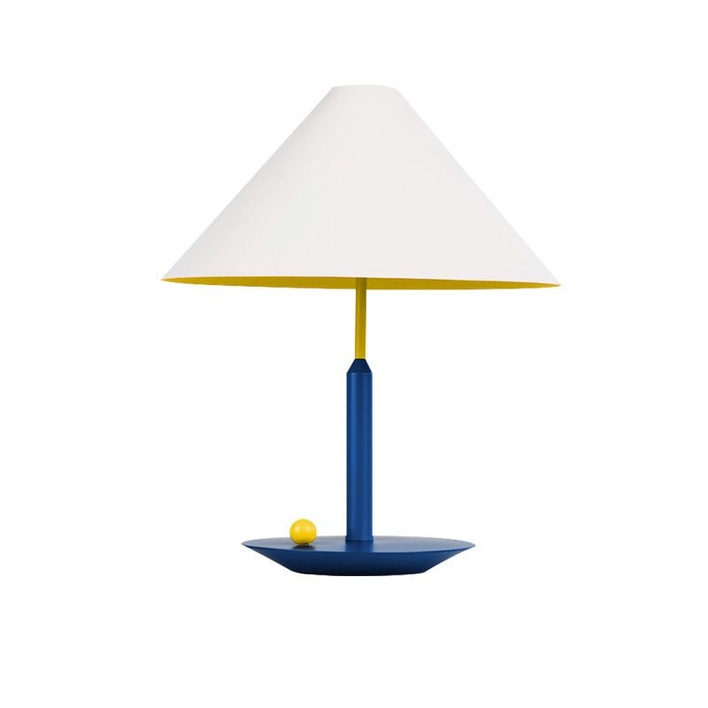 Top rated cone shape lamp for study illuminating a desk with a warm ambiance.