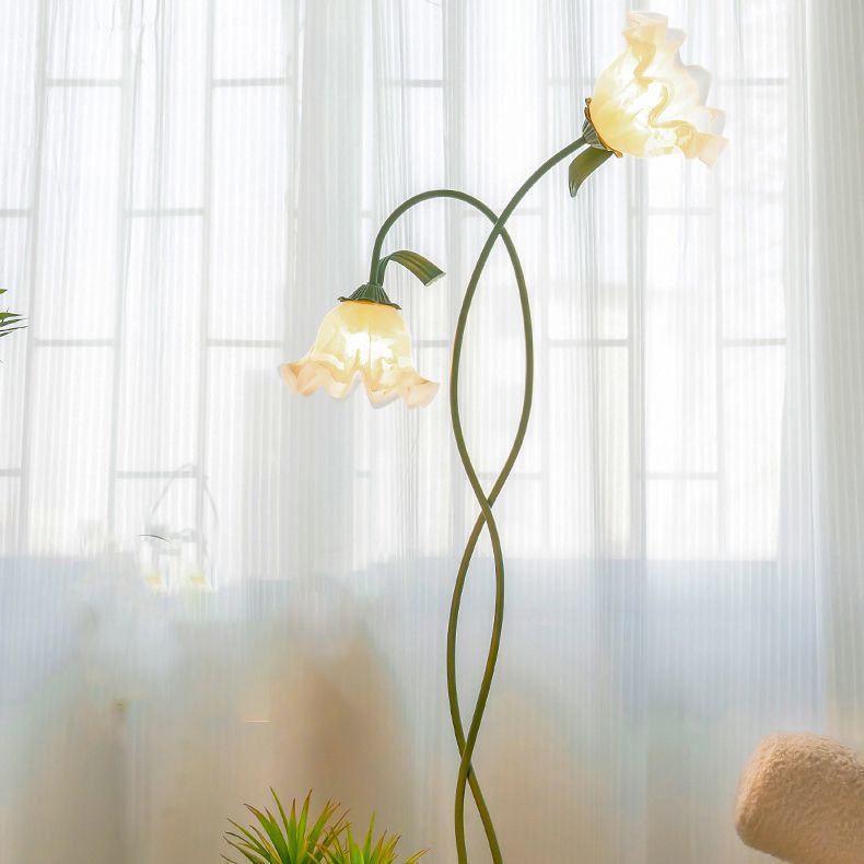 Green linear floor lamp positioned next to a modern sofa