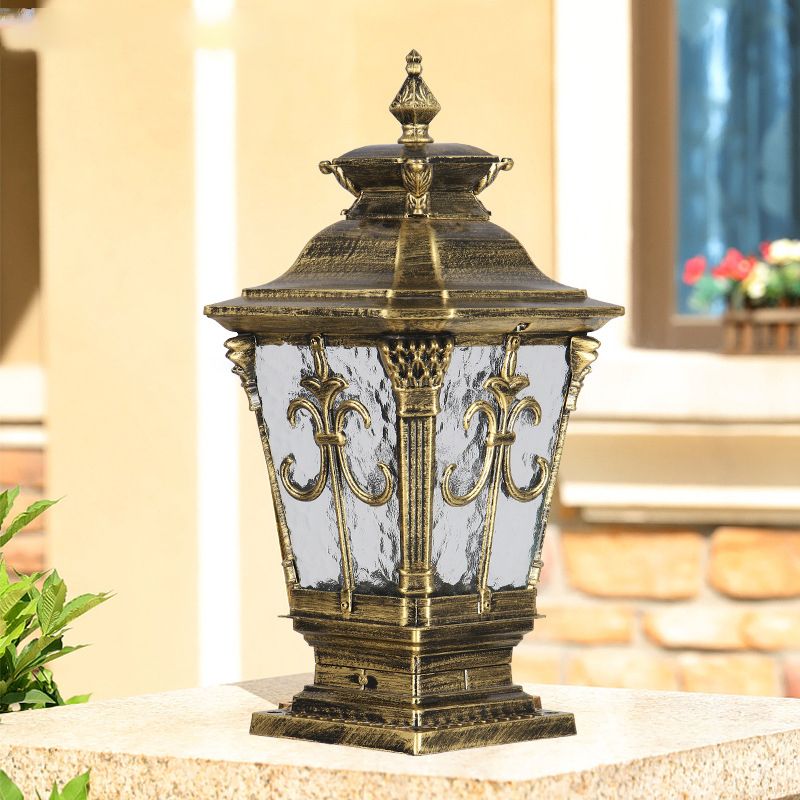 Close-up view of the durable solar post light showcasing its glass shade and metal frame.