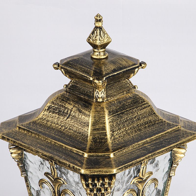 Close-up view of the durable solar post light showcasing its glass shade and metal frame.
