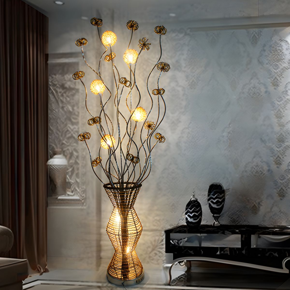 Elegant gold metallic bamboo lamp illuminating a modern living room.