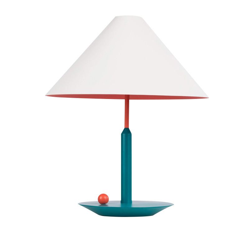 Elegant modern cone table lamp showcasing its stylish fabric shade in a cozy living room setting.