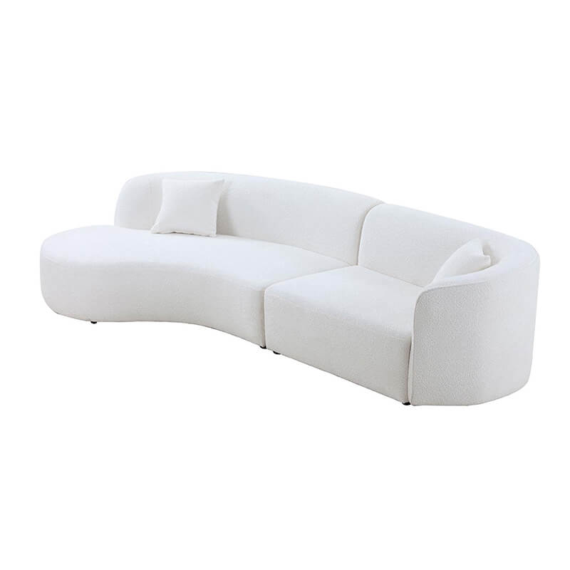 Stylish arrangement of the curved sofa in a cozy home office.