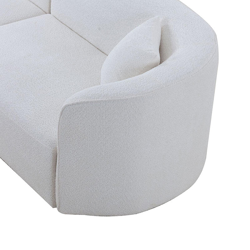 Elegant 126" curved luxury sofa set with chaise in a bright living room.